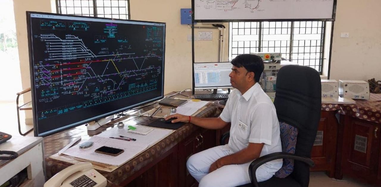 Station Master working with the newly installed system at Mangaluru Central Railway Station. Credit: Special Arrangement
