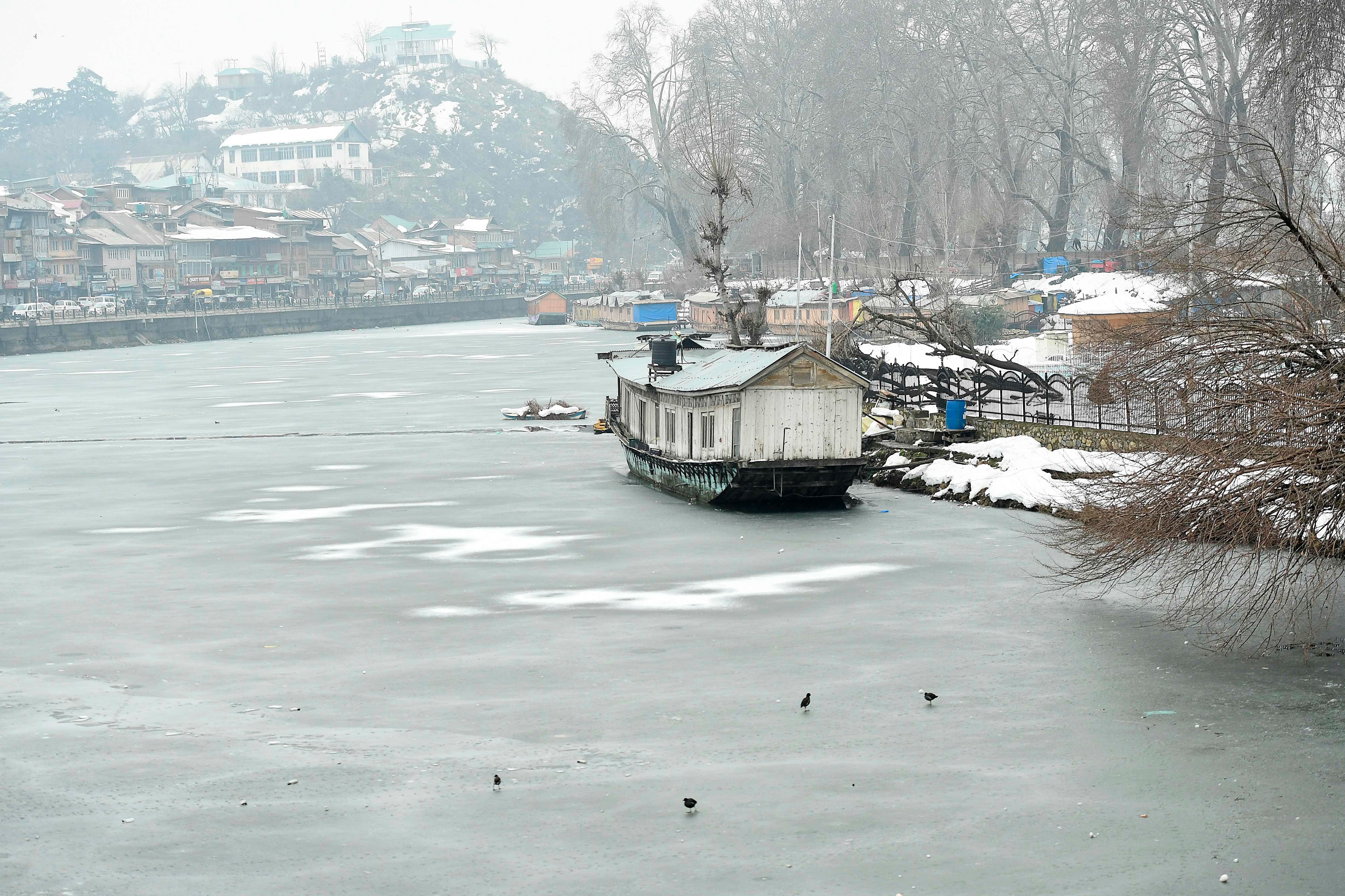 House Boat are seen near a frozen portion of Dal Lake in Srinagar on February 3, 2021. Representative image/Credit: PTI Photo
