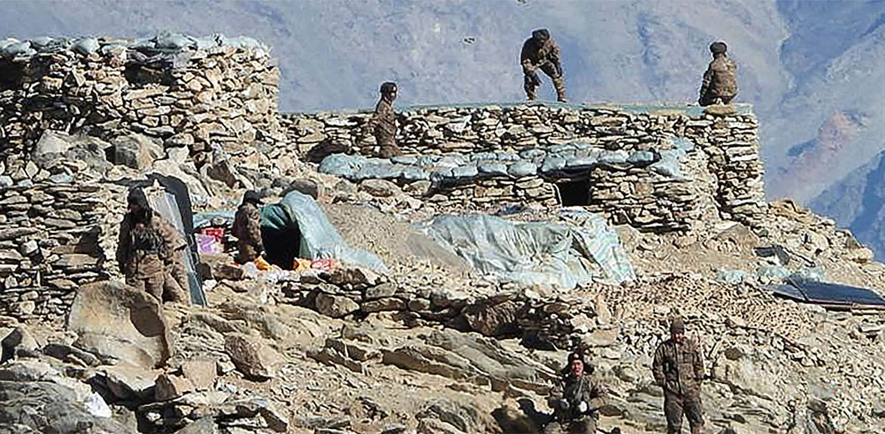 People Liberation Army (PLA) soldiers during military disengagement along the Line of Actual Control (LAC) at the India-China border in Ladakh. Credit: AFP Photo/Indian Army Handout