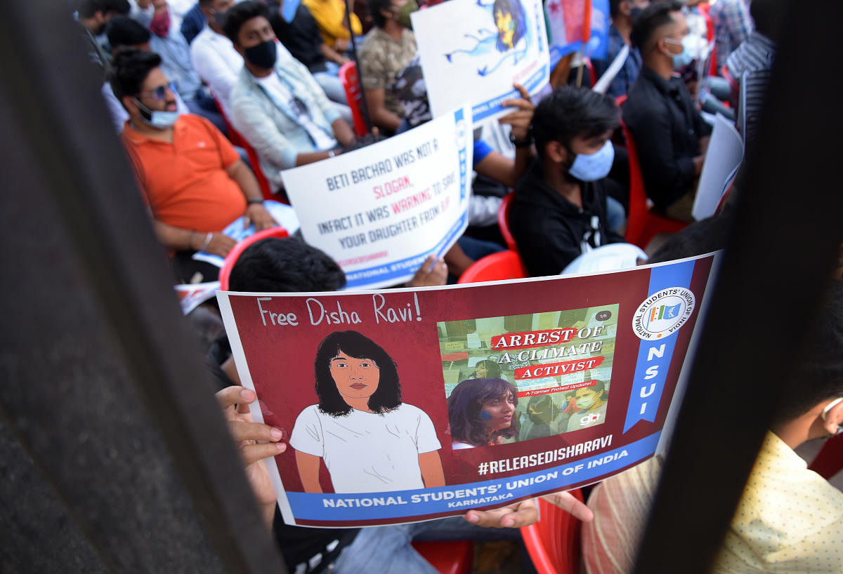 Students and members of NSUI stage a protest condemning the arrest of climate activist Disha Ravi and against the state government demanding two-three days holiday before every exam, in Bengaluru, Tuesday, Feb 16, 2021. Credit: DH Photo/Pushkar V