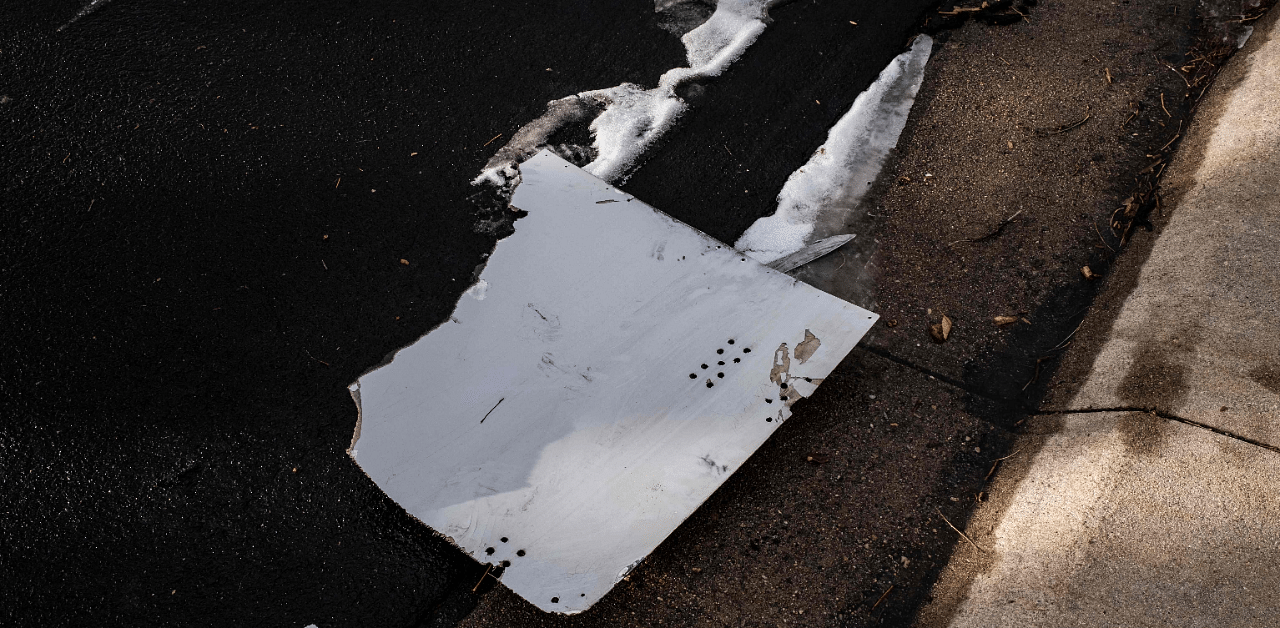 Debris fallen from a United Airlines airplane's engine lay scattered through the neighborhood of Broomfield, outside Denver, Colorado. Credit: AFP Photo