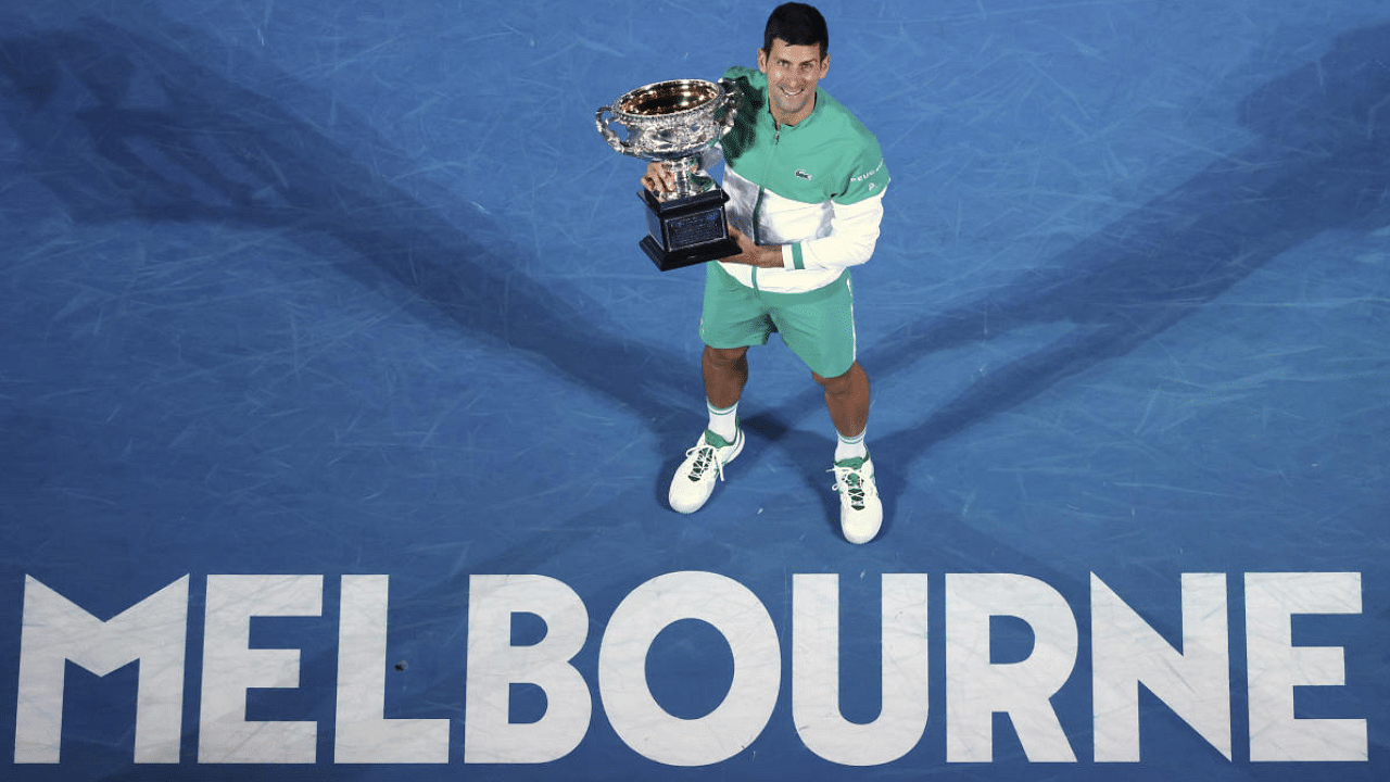 Serbia's Novak Djokovic holds the Norman Brookes Challenge Cup after defeating Russia's Daniil Medvedev. Credit: AP Photo