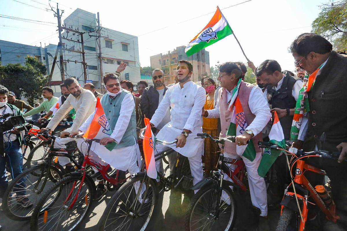 Congress MLAs ride bicycles as they stage a protest against the hike in fuel price on the opening day of the Budget Session of Madhya Pradesh Assembly, in Bhopal. Credit: PTI photo. 