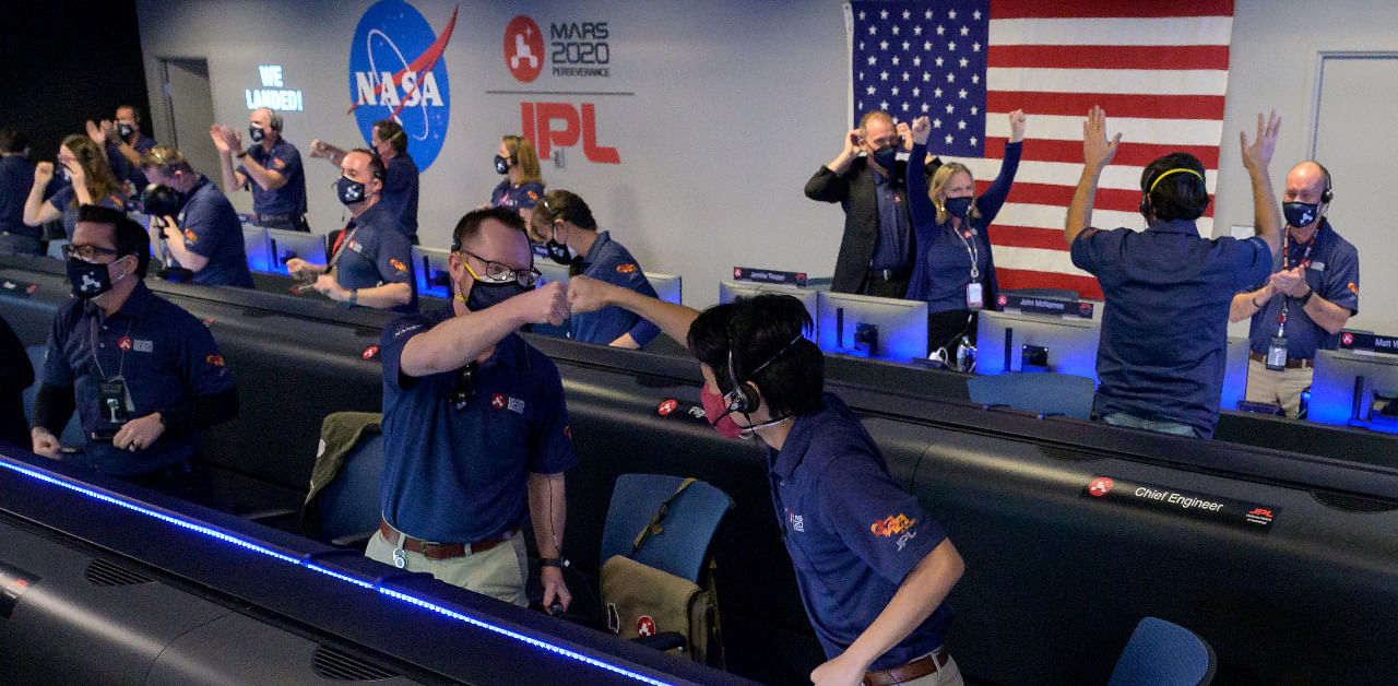 Members of NASA’s Perseverance rover team react in mission control after receiving confirmation the spacecraft successfully touched down on Mars. Credit: Reuters Photo