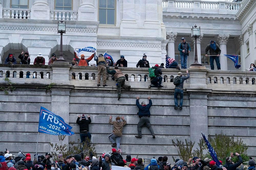 The rioters easily smashed through security barriers on the outside of the Capitol on January 6. Credit: AP File Photo