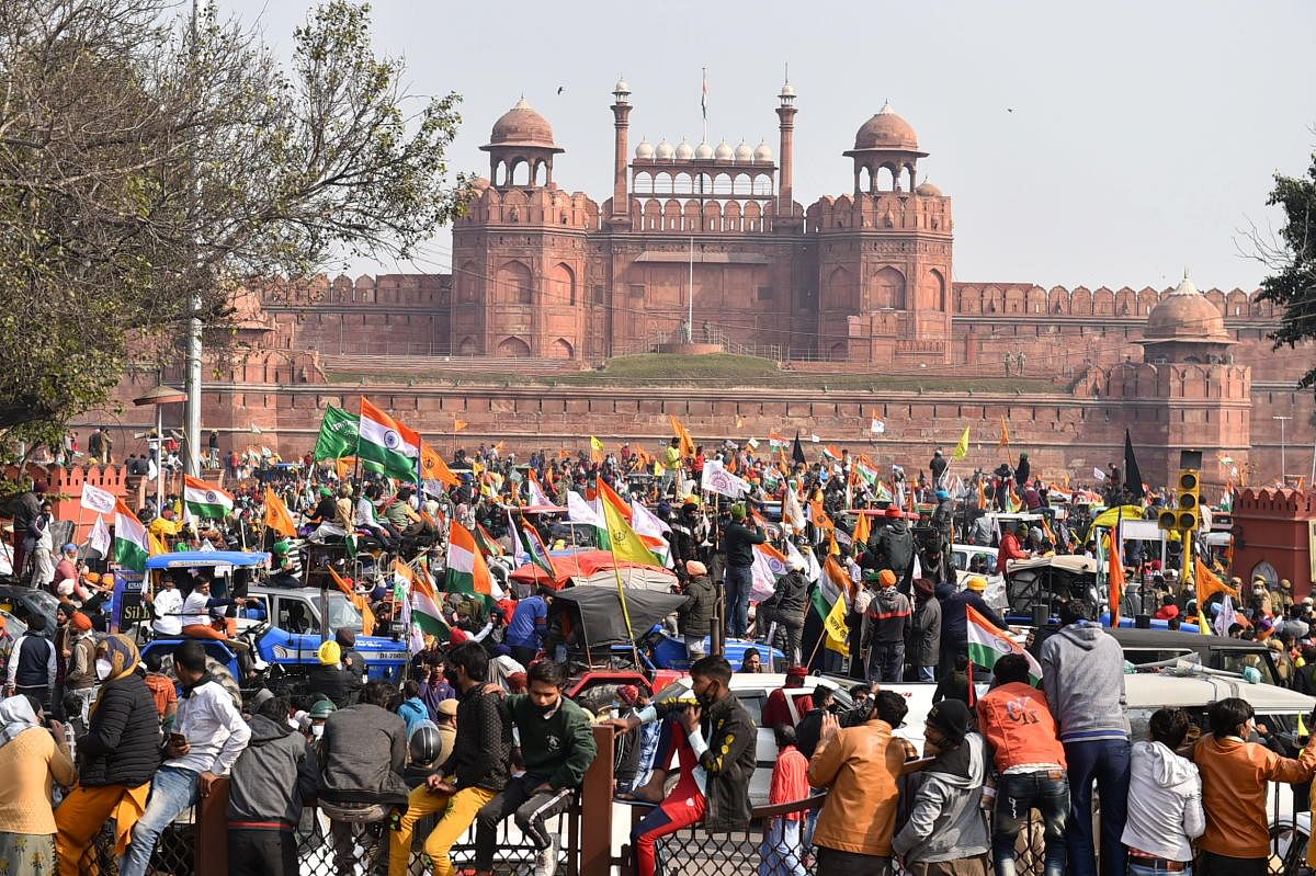 Farmers gather at Red Fort during their tractor parade on Republic Day, in New Delhi. Credit: PTI photo. 