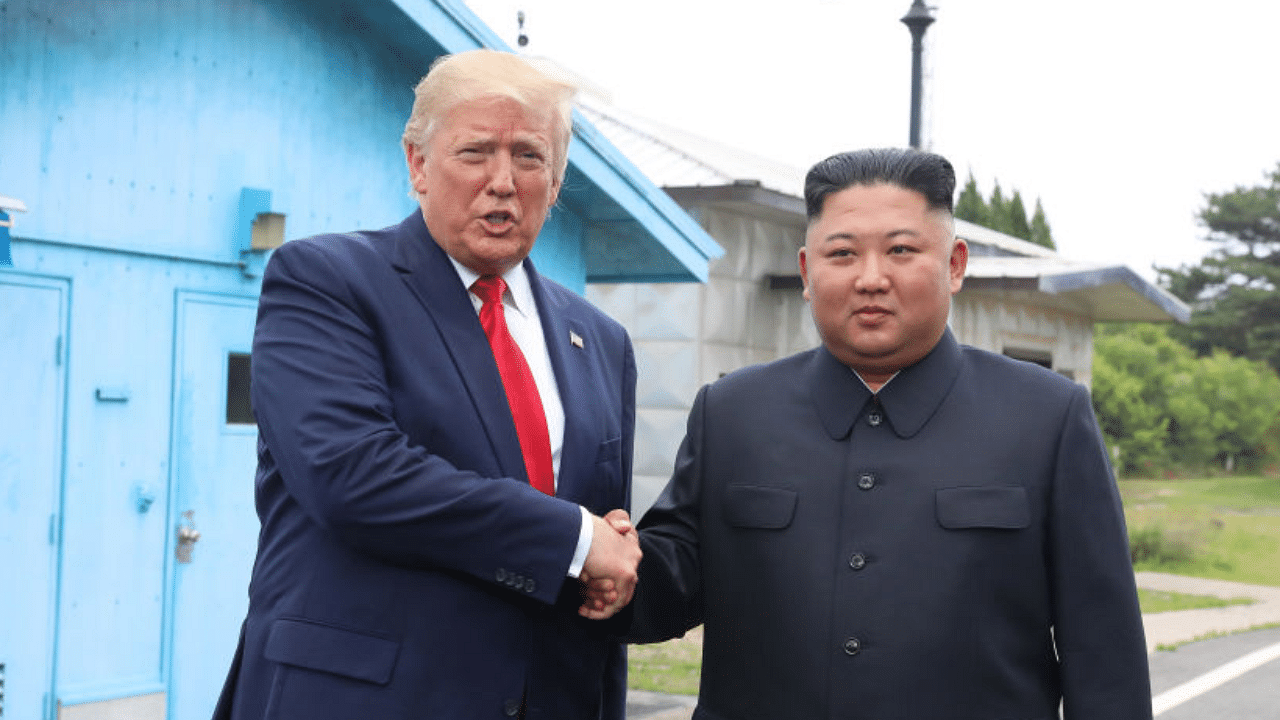 A handout photo provided by Dong-A Ilbo of North Korean leader Kim Jong Un and U.S. President Donald Trump inside the demilitarized zone (DMZ) separating the South and North Korea on June 30, 2019 in Panmunjom, South Korea. Credit: Getty Images