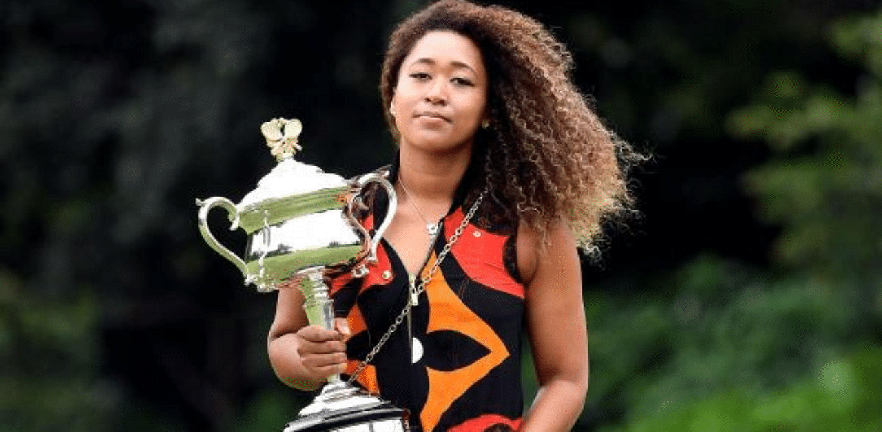 Japan’s Naomi Osaka poses with the 2021 Australian Open winner's trophy. Credit: AFP Photo