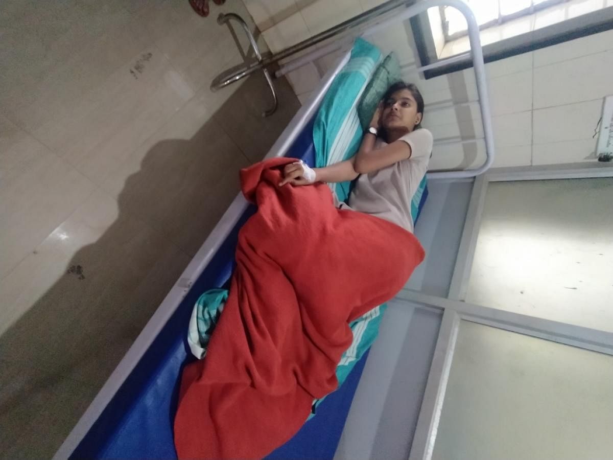 Raksha, a student, who had collapsed while running after spotting a tiger, being treated at Gonikoppa CHC.