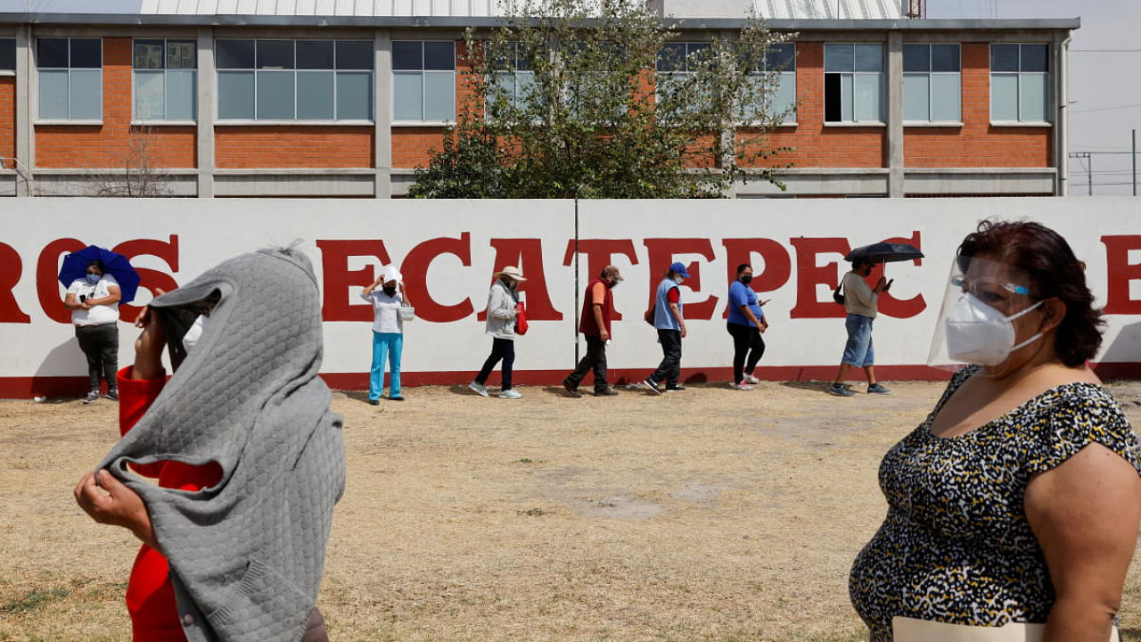 People queue for the Sinovac coronavirus vaccine during a mass vaccination in Ecatepec, state of Mexico. Credit: Reuters.