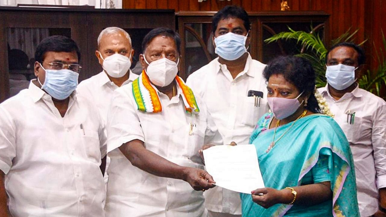  Puducherry Chief Minister V Narayanasamy hands over his resignation letter to Lt Governor Dr Tamilisai Soundararajan. Credit: PTI File Photo