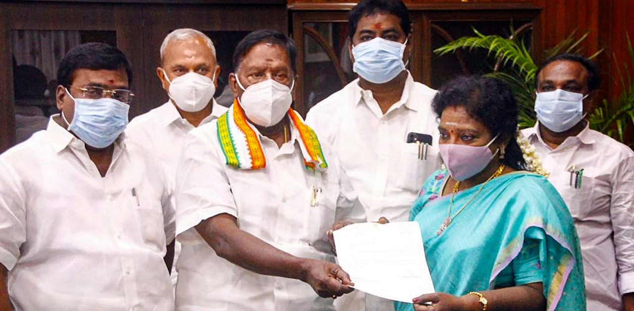 Puducherry Chief Minister V Narayanasamy hands over his resignation letter to Lt Governor Dr Tamilisai Soundararajan. Credit: PTI Photo