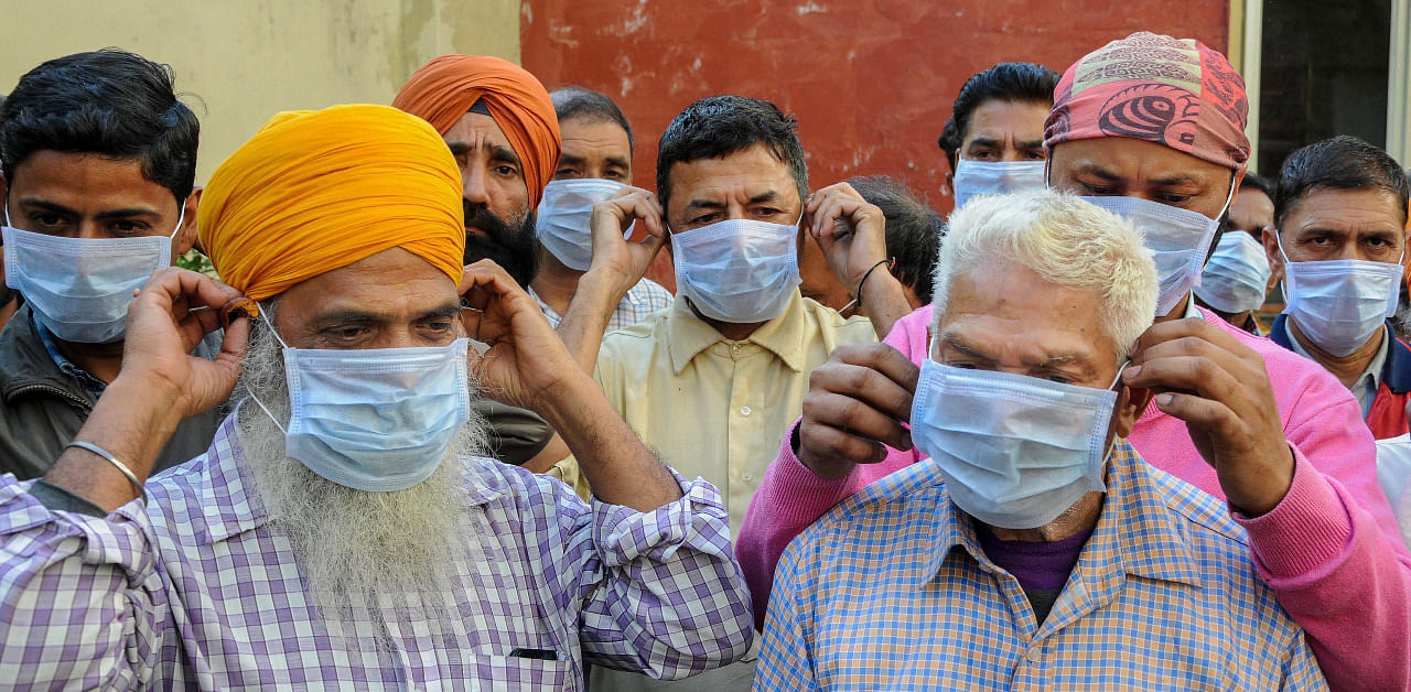 People in Punjab wear face masks. Credit: PTI Photo
