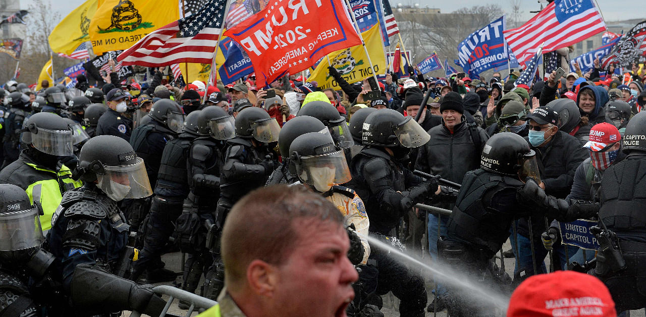 Trump supporters clash with police and security forces as people try to storm the US Capitol. Credit: AFP File Photo