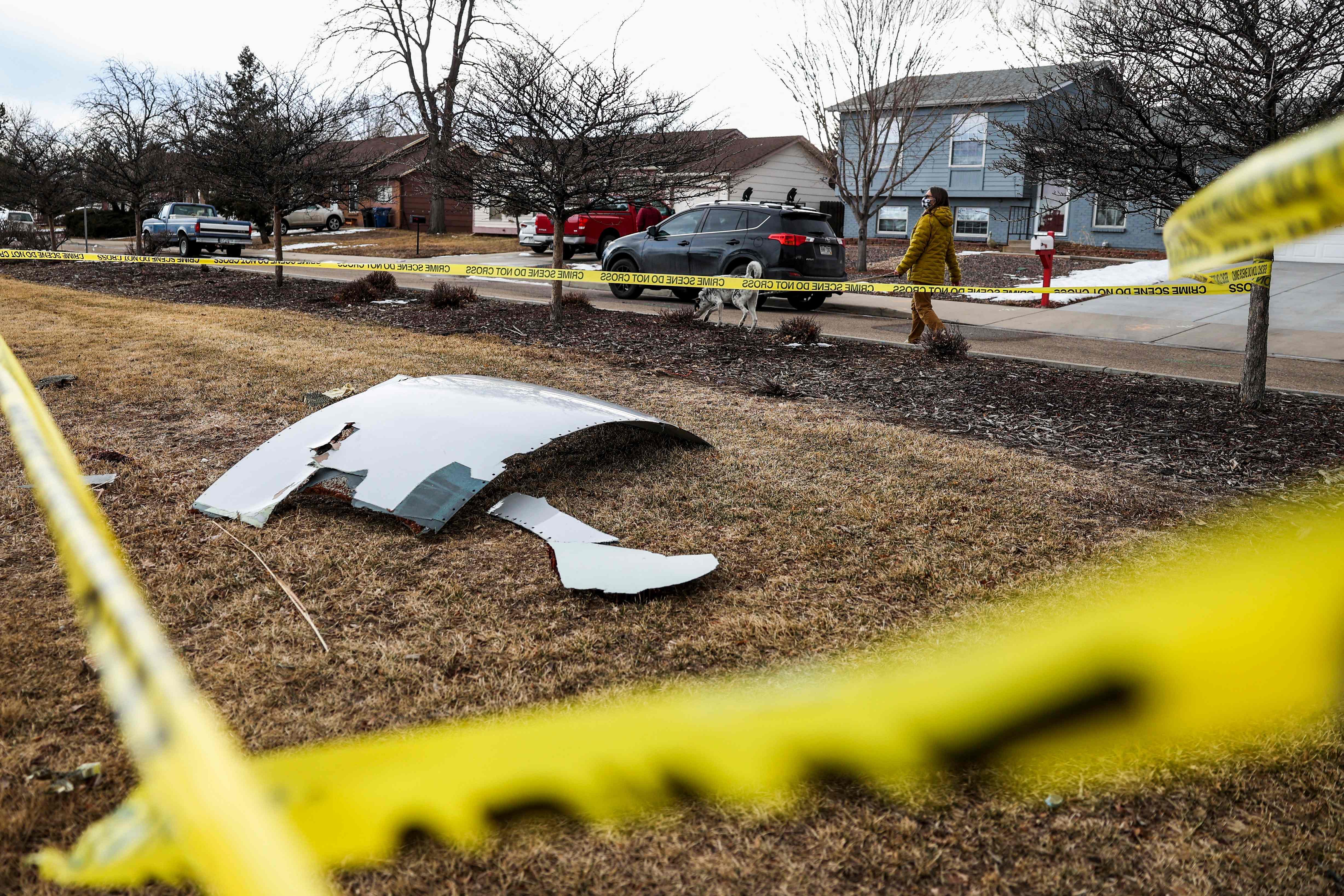 An airplane engine from Flight 328 sit scattered in a neighborhood. Credit: AFP Photo