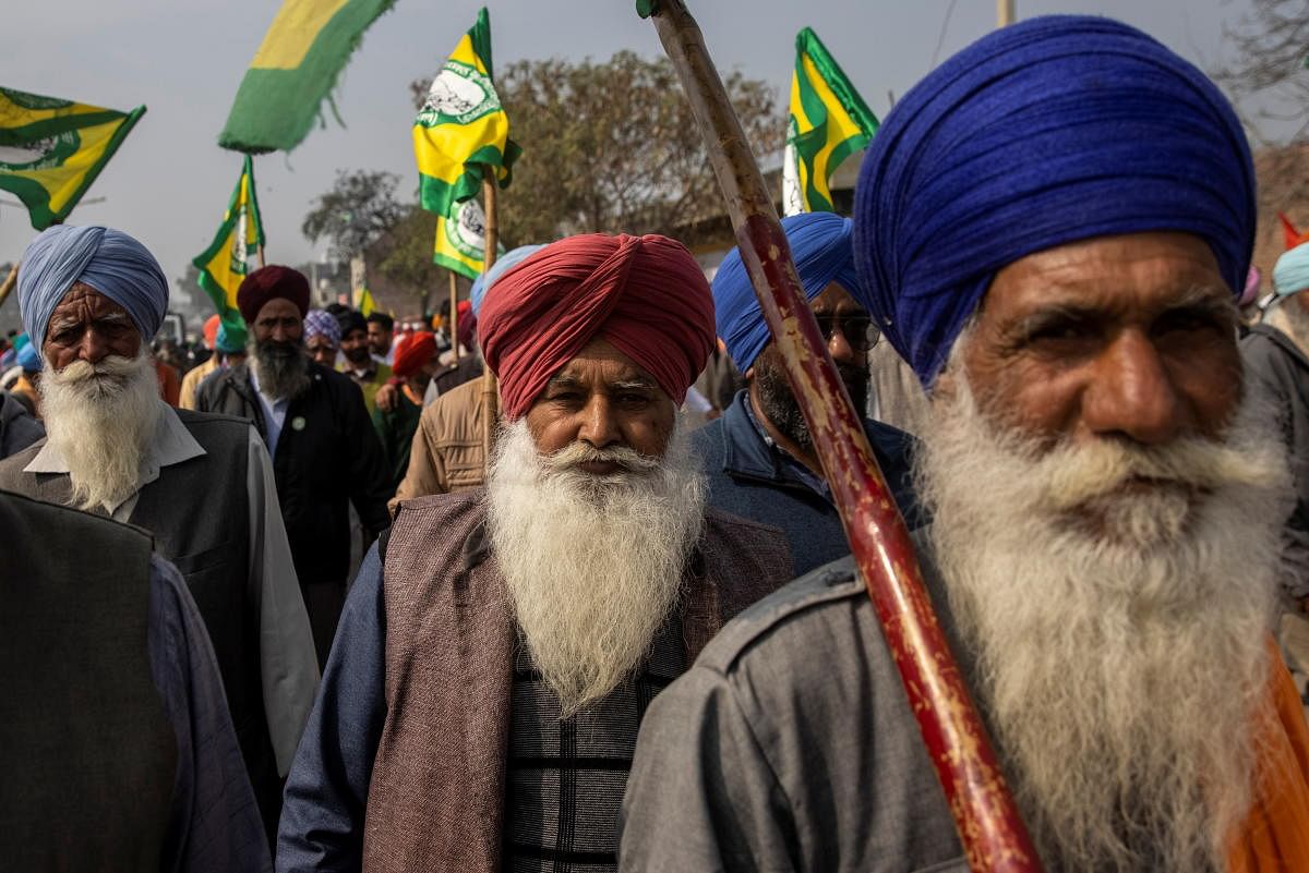 Farmers and agricultural workers arrive to attend a rally against farm laws, in Barnala, northern state of Punjab, India, February 21, 2021. REUTERS/Danish Siddiqui
