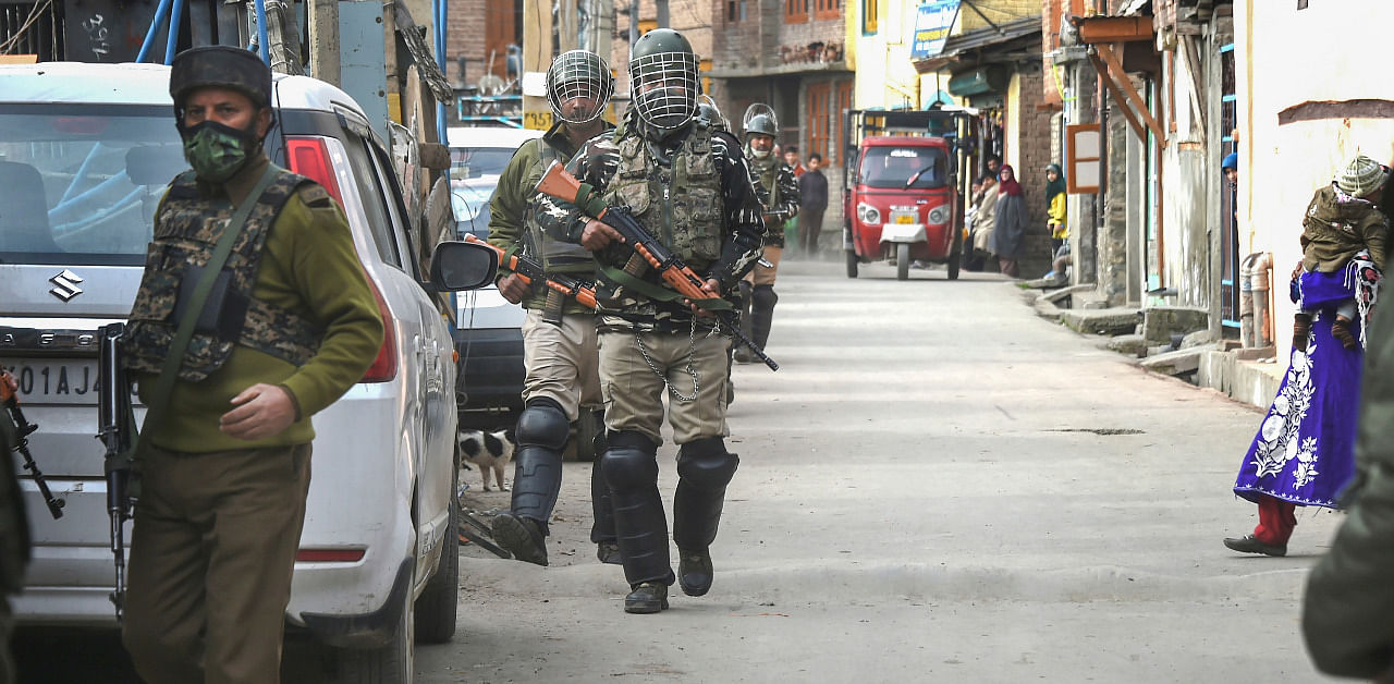  Security personnel launch a cordon and search operation at Kawdara in Downtown Srinagar. Credit: PTI Photo