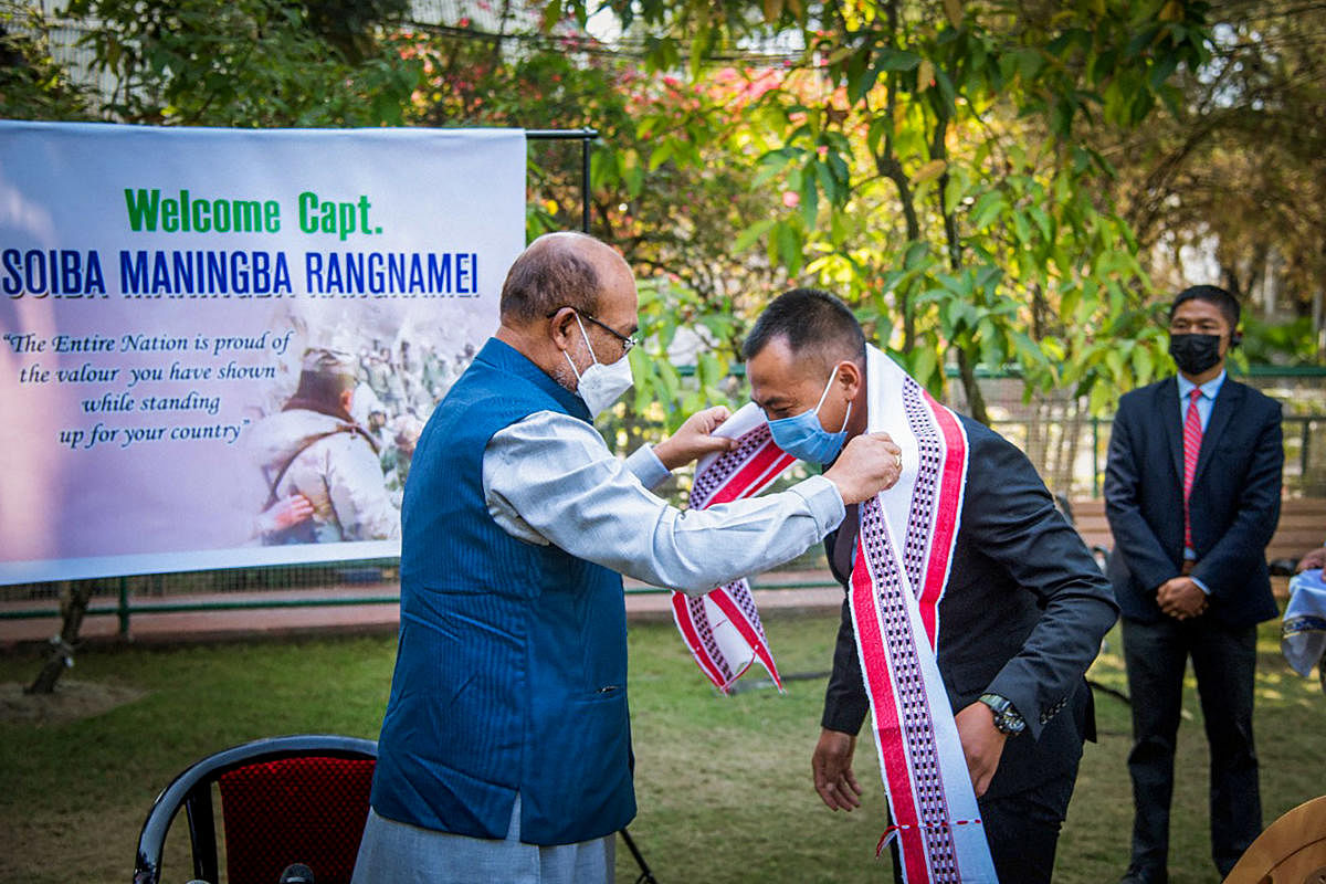 Chief Minister N Biren Singh felicitates Capt. Soiba Maningba Rangnamei of 16 Bihar Regiment and resident of Senapati Dist, who led his men during the Galwan confrontation, in Manipur. Credit: PTI photo. 