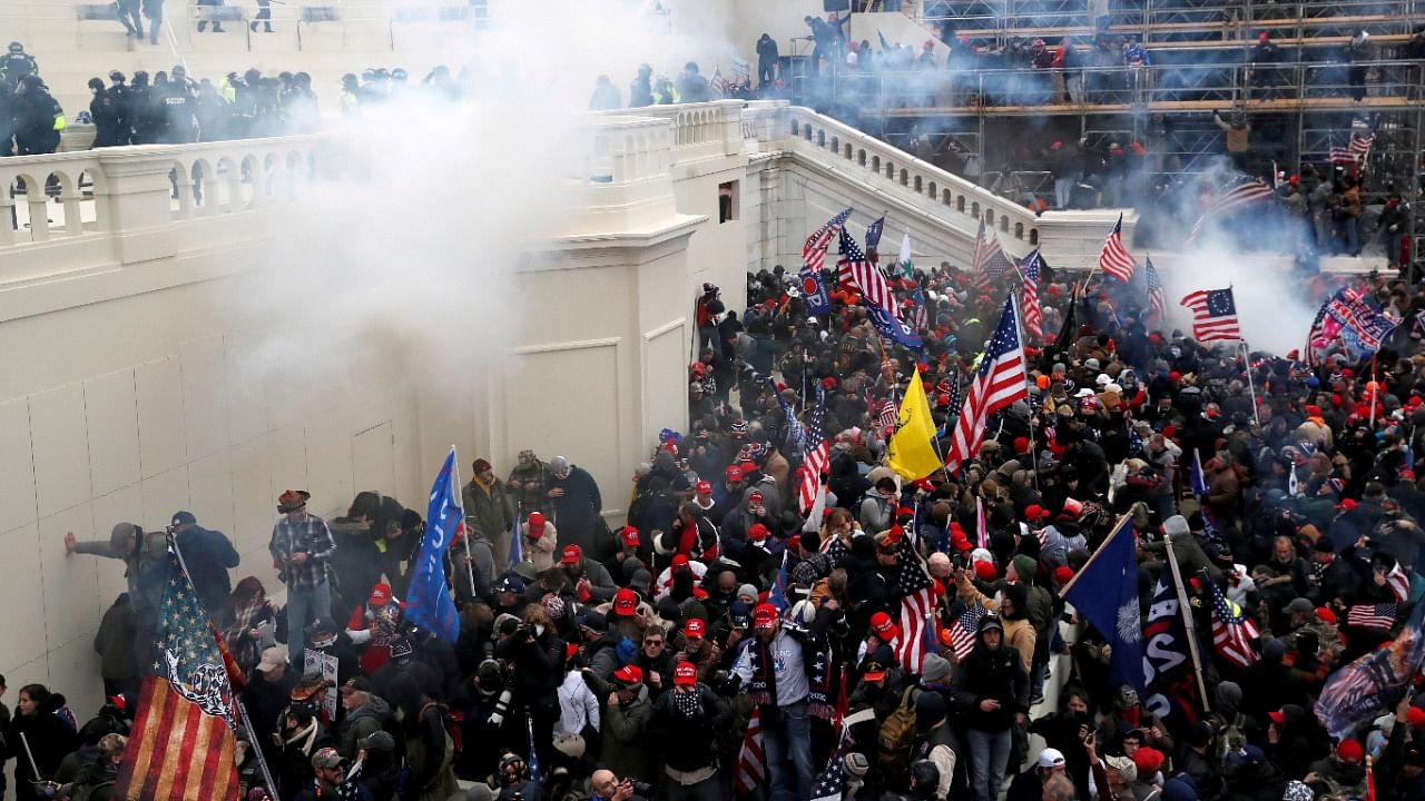 Police release tear gas into a crowd of pro-Trump protesters during clashes at a rally to contest the certification of the 2020 US presidential election results by the US Congress, at the US Capitol Building in Washington, US, January 6, 2021. Credit: Reuters File Photo