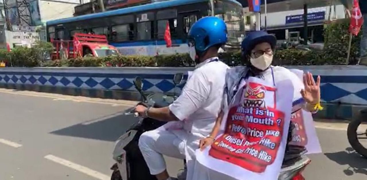 West Bengal Chief Minister Mamata Banerjee on an electric scooter. Credit: Twitter/@AITCofficial