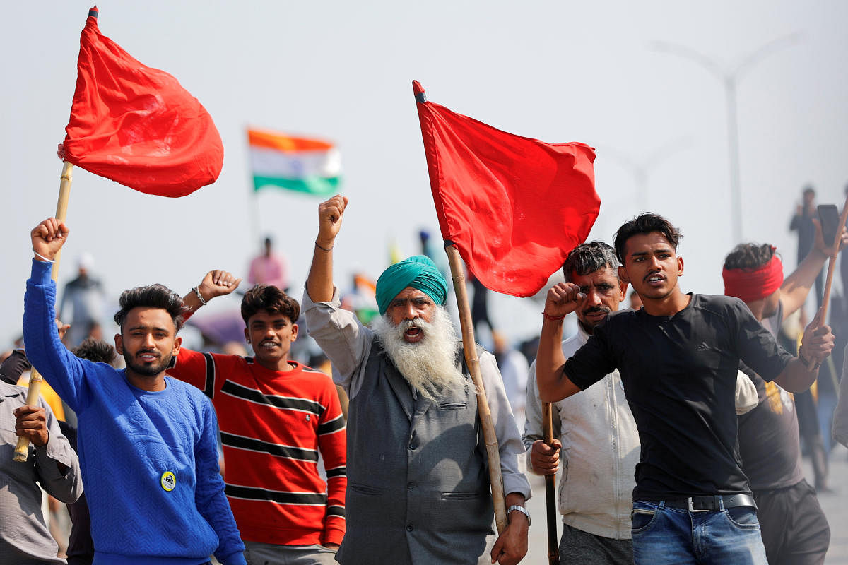 Farmers shout slogans as they take part in a three-hour "chakka jam" or road blockade, as part of protests against farm laws on a highway on the outskirts of New Delhi, India, February 6, 2021. Credit: REUTERS File Photo