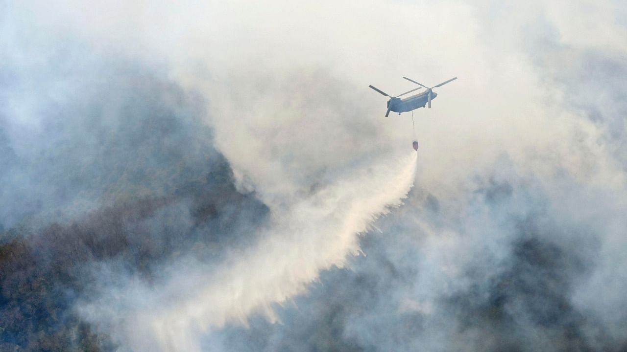 Helicopter dumps water on a wildfire in Ashikaga, Tochigi prefecture, north of Tokyo Wednesday, February 24, 2021. Creit: AP/PTI Photo