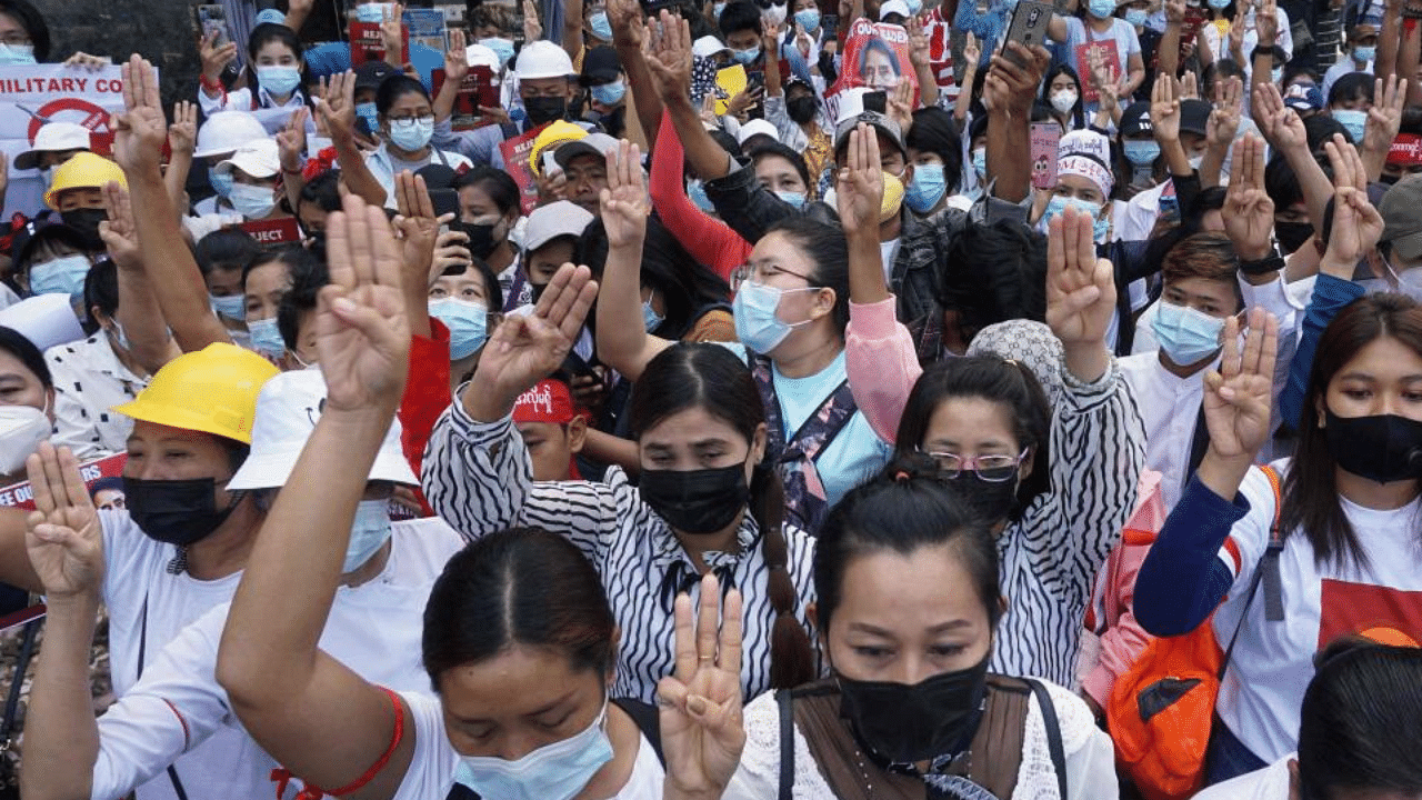 Protesters hold up the three finger salute during a demonstration against the military coup in Yangon on February 26, 2021. Credit: AFP Photo