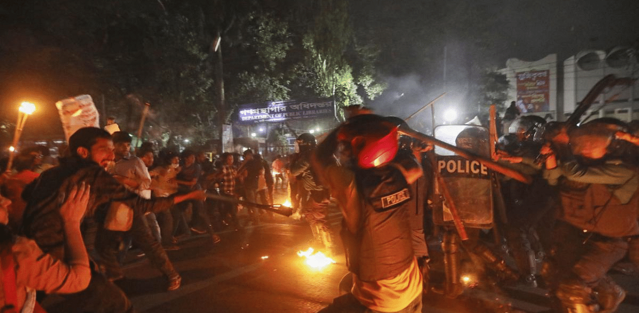  Demonstrators clash with police as they protest the death in prison of a writer who was arrested on charges of violating the sweeping digital security, in Dhaka, Bangladesh. Credit: AP Photo
