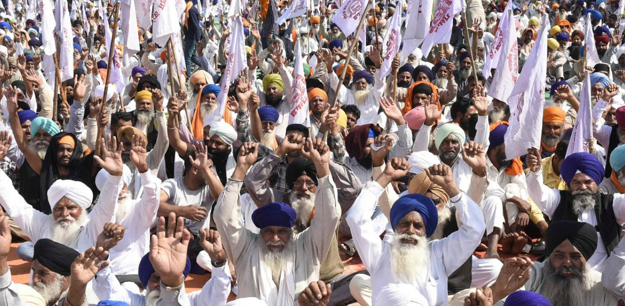 Farmers shout slogans during a rally. Credit: AFP photo. 