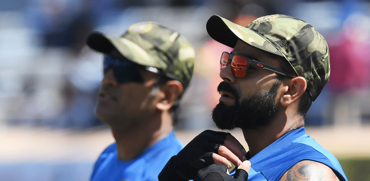 Indian cricket captain Virat Kohli and Mahendra Singh Dhoni. Credit: AFP Photo