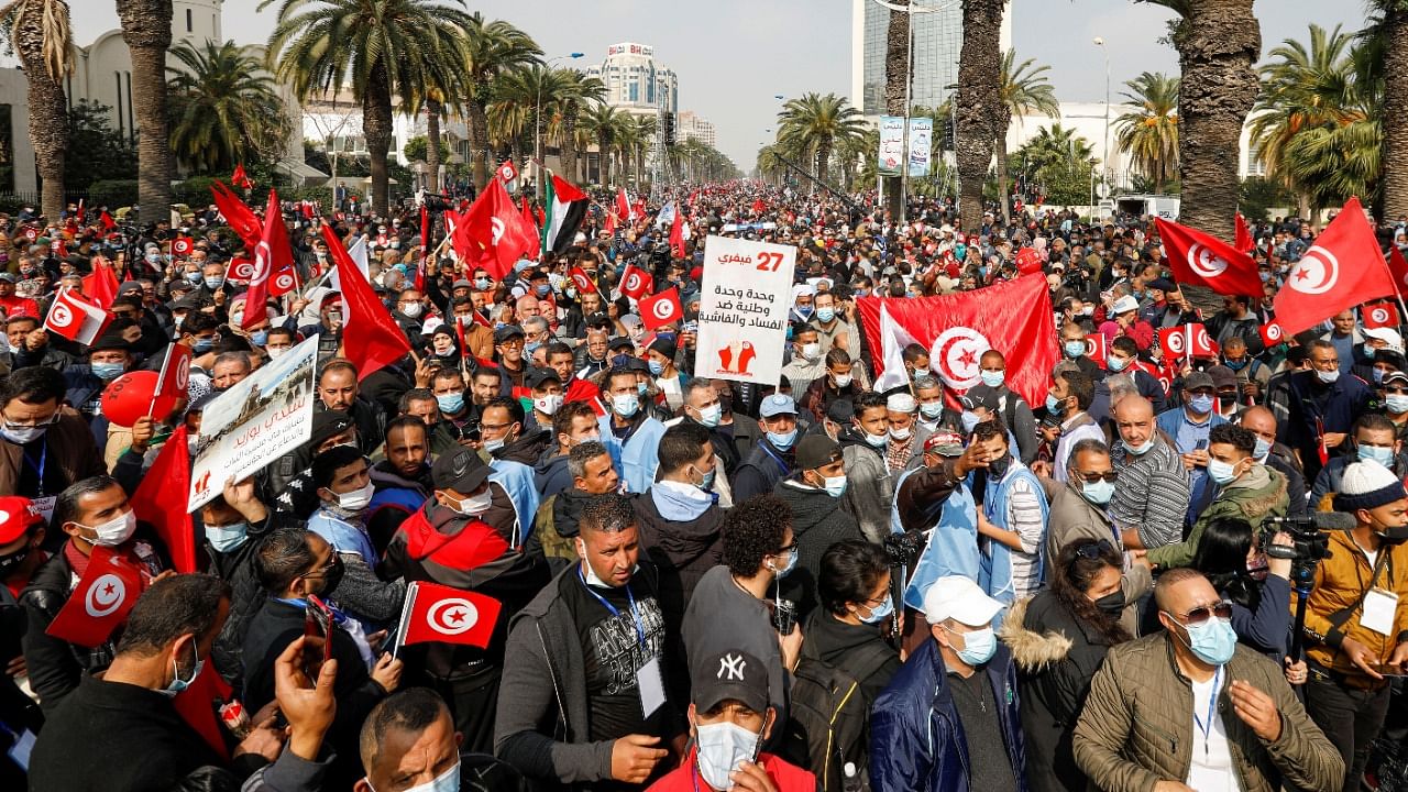 Supporters of Tunisia's biggest political party, the moderate Islamist Ennahda, march during a rally in opposition to President Kais Saied, in Tunis, Tunisia. Credit: Reuters Photo