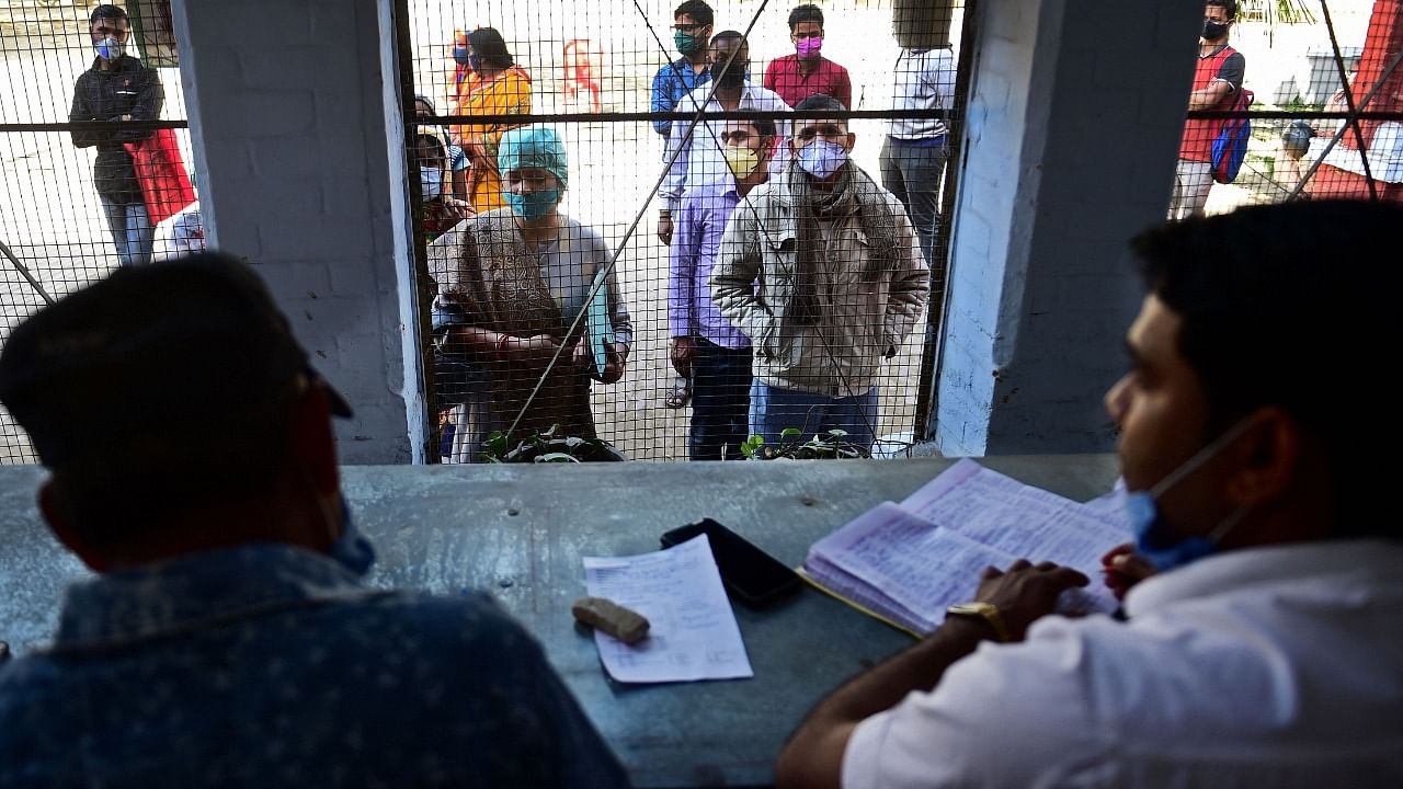 People register their names to get tested for the Covid-19 coronavirus at a testing centre in Allahabad on February 26, 2021. Credit: AFP Photo