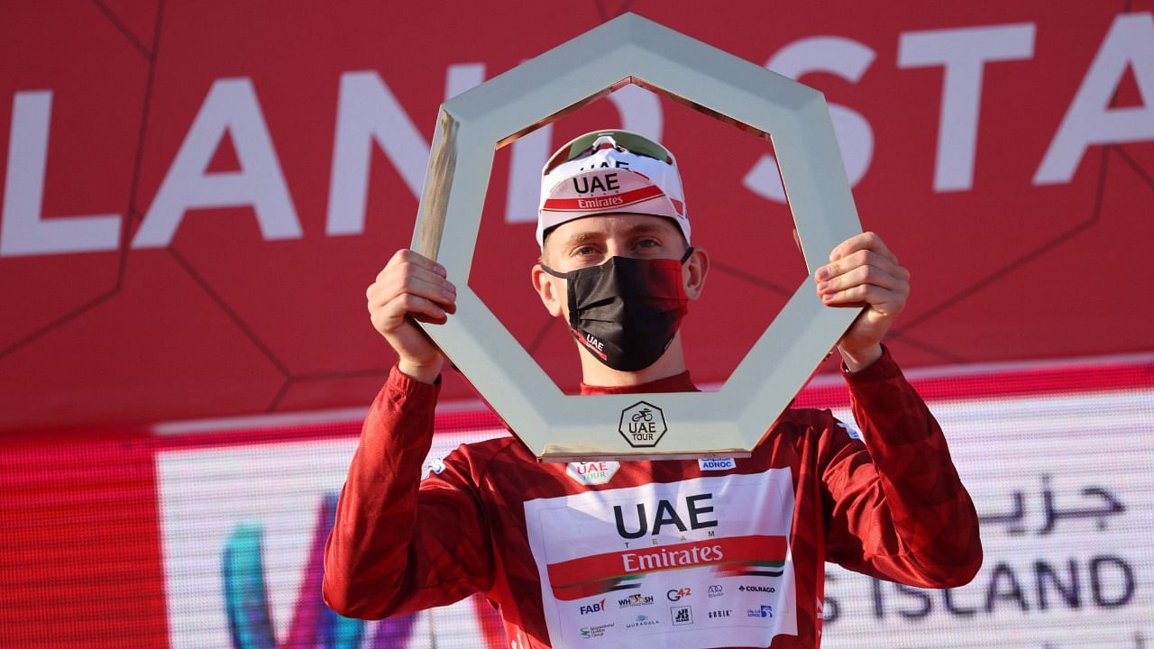 Tadej Pogacar of Team UAE Emirates celebrates on the podium after winning the UAE Cycling Tour from Yas Mall to Abu Dhabi Breakwater. Credit: AFP Photo