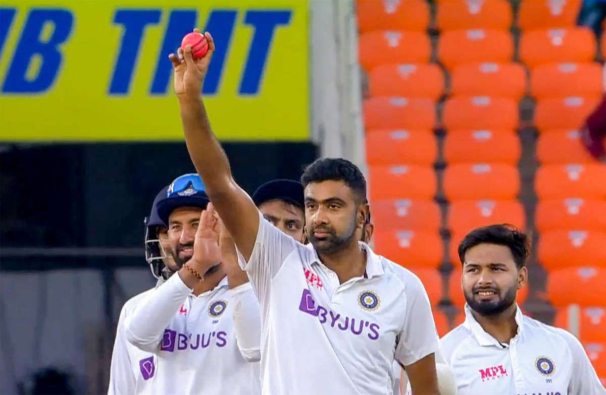 Indian bowler R Ashwin reacts on completing 400 Test wickets. Credit: PTI photo. 