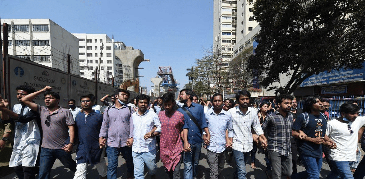 Activists march and shout slogans during a demonstration in Dhaka on February 27, 2021 following the death of writer Mushtaq Ahmed in jail months after his arrest under internet laws which critics say are used to muzzle dissent. Credit: AFP Photo