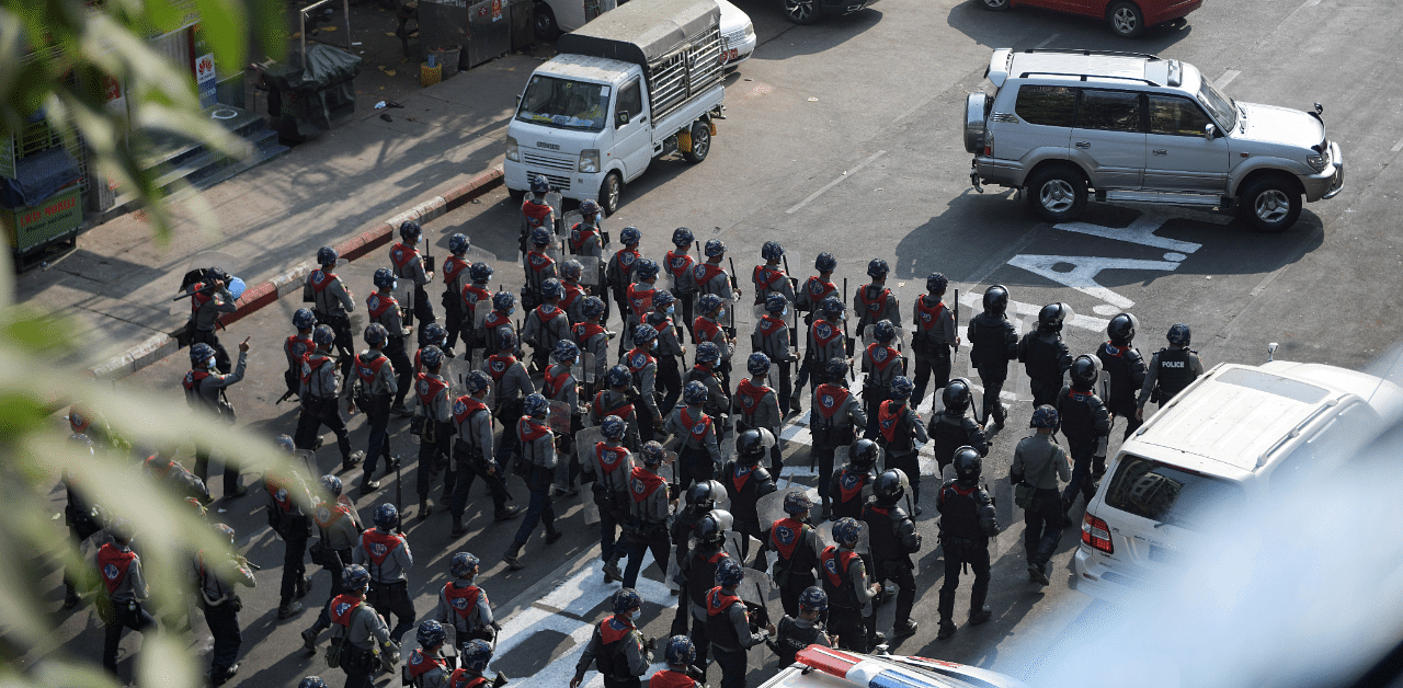 In this file photo riot police walk in the middle of a street during a protest against the military coup in Yangon. Credit: Reuters Photo