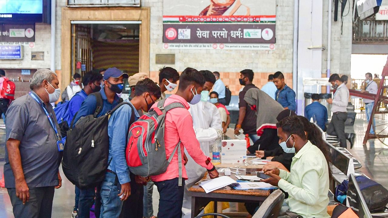 Passengers being screened for coronavirus tests at the CSMT railway station, owing to surge in Covid-19 cases in Mumbai. Credit: PTI Photo