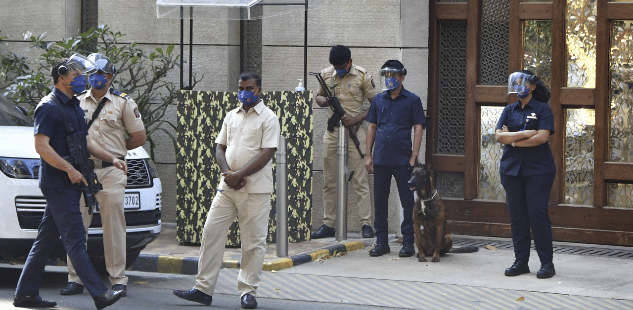 Police personnel guard outside industrialist Mukesh Ambai's residence Antilla. Credit: PTI Photo