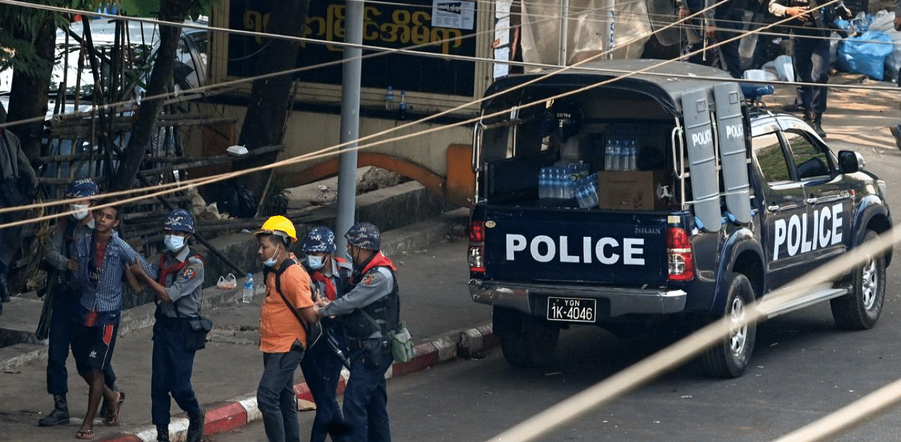 Police arrest people in Yangon on February 27, 2021 after a crackdown on demonstrations against the military coup. Credit: AFP Photo