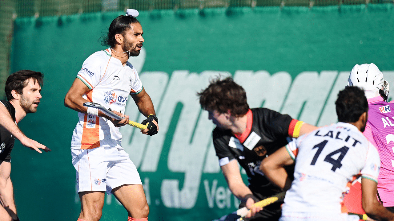 Team India in action against Germany. Credit: Twitter/@TheHockeyIndia