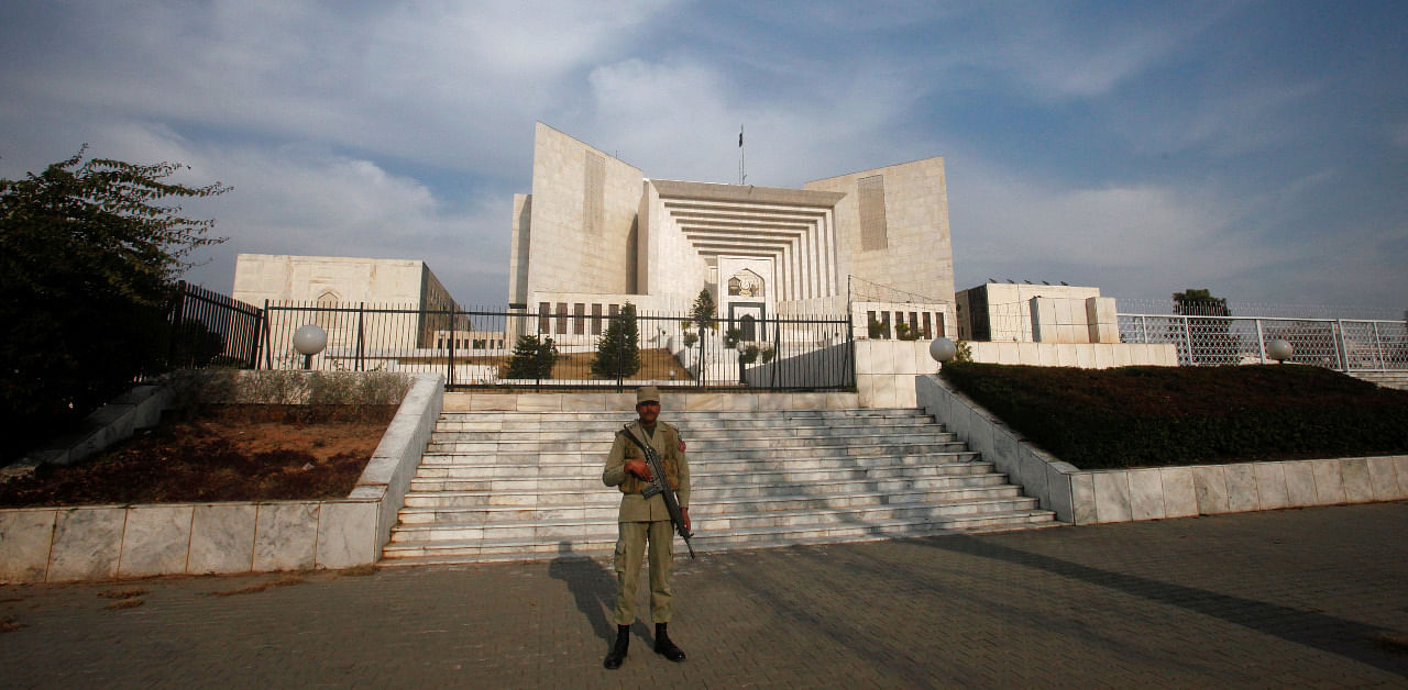 A paramilitary soldier keeps guard outside the Supreme Court building in Islamabad, Pakistan. Credit: Reuters Photo