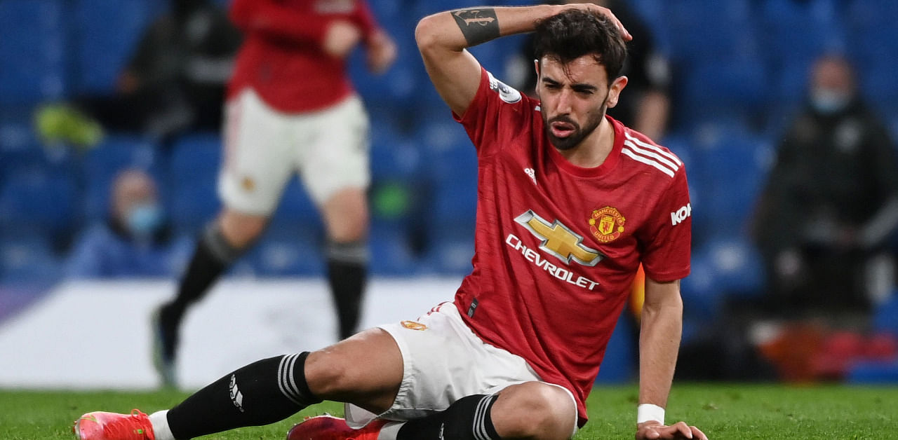 Manchester United's Bruno Fernandes reacts after a blow. Credit: Reuters Photo