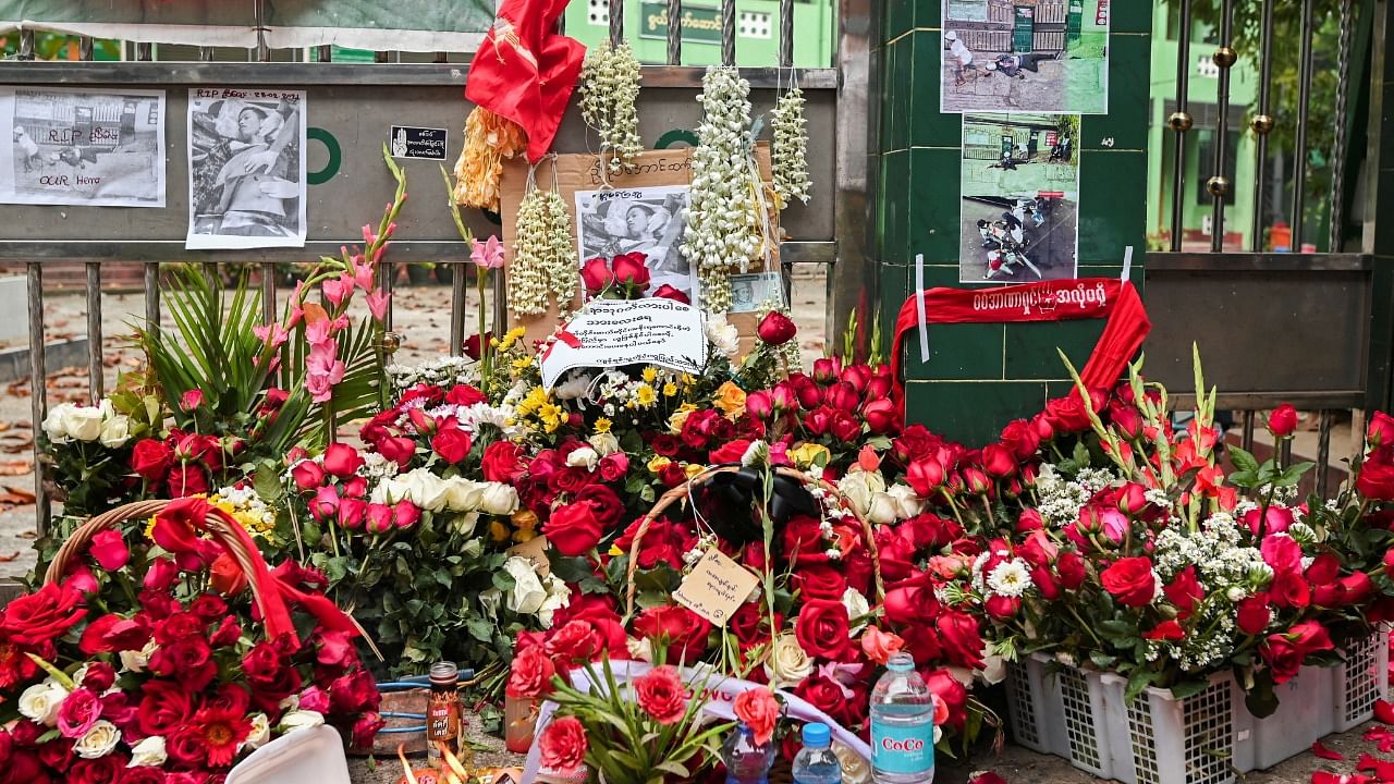 Flowers are seen placed at a memorial site where a man was shot dead yesterday while police were trying to disperse an anti-coup demonstration in Yangon, Myanmar, March 1, 2021. Credit: Reuters Photo