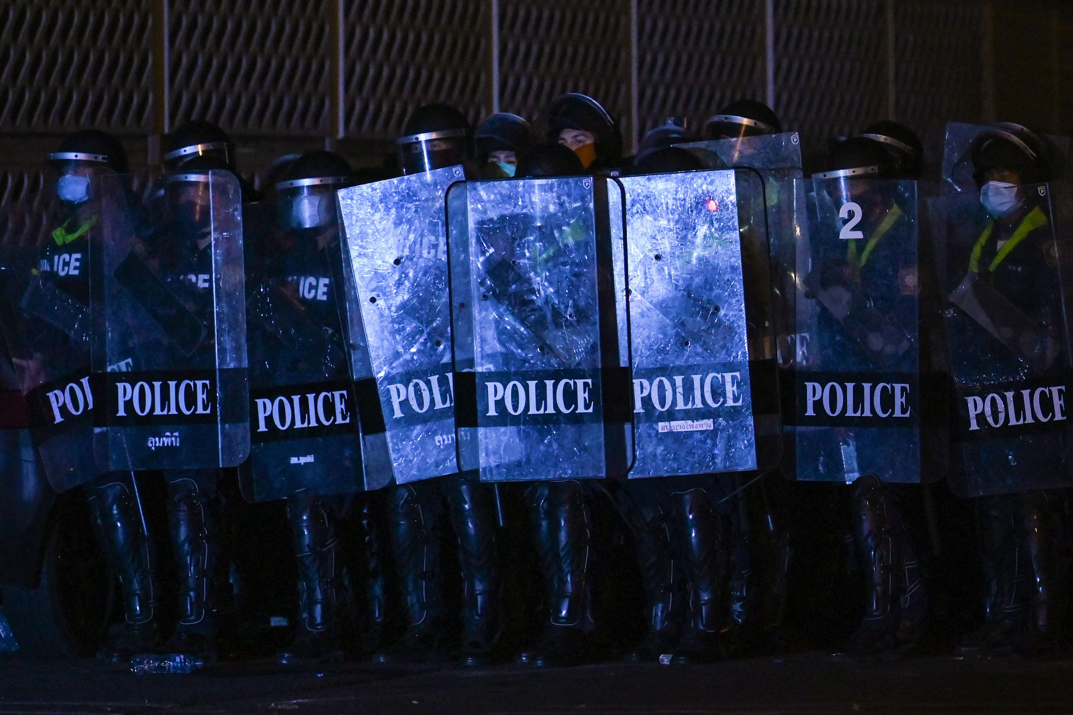 Riot police face off against pro-democracy protesters taking part in a demonstration headed toward the residence of Thailand's Prime Minister Prayut Chan-O-Cha in Bangkok on February 28, 2021. Credit: AFP Photo