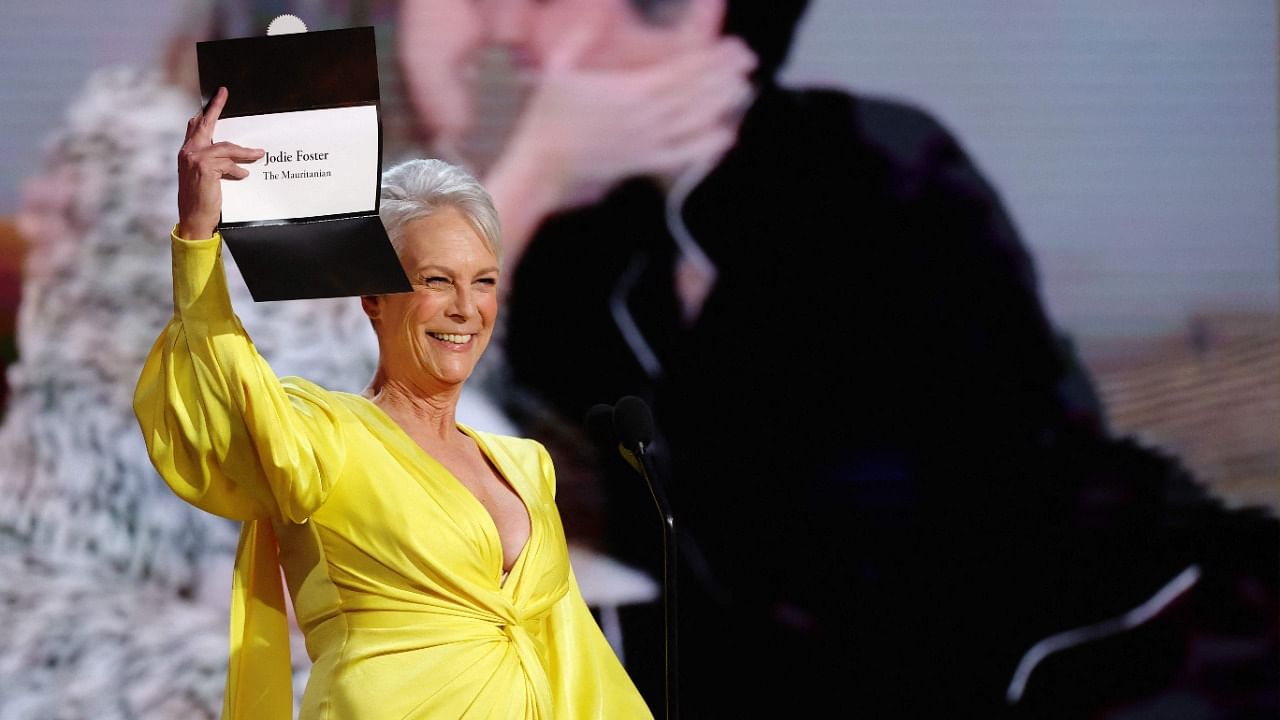 This handout photo courtesy of NBCUniversal shows Jamie Lee Curtis announcing Jodie Foster's win for Best Supporting Actress in a film for 'The Mauritanian' onstage at the 78th Annual Golden Globe Awards held at the Beverly Hilton Hotel in Beverly Hills, California, on February 28, 2021. Credit: AFP