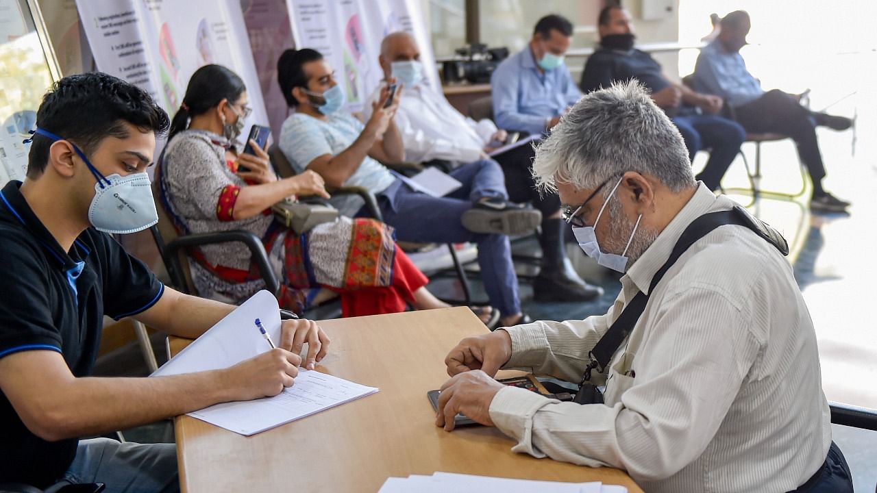 Elderly people register themselves to receive a dose of Covid-19 vaccine, during the second phase of the countrywide inoculation drive, at Dr Ram Manohar Lohia Hospital in New Delhi on March 1, 2021. Credit: PTI Photo