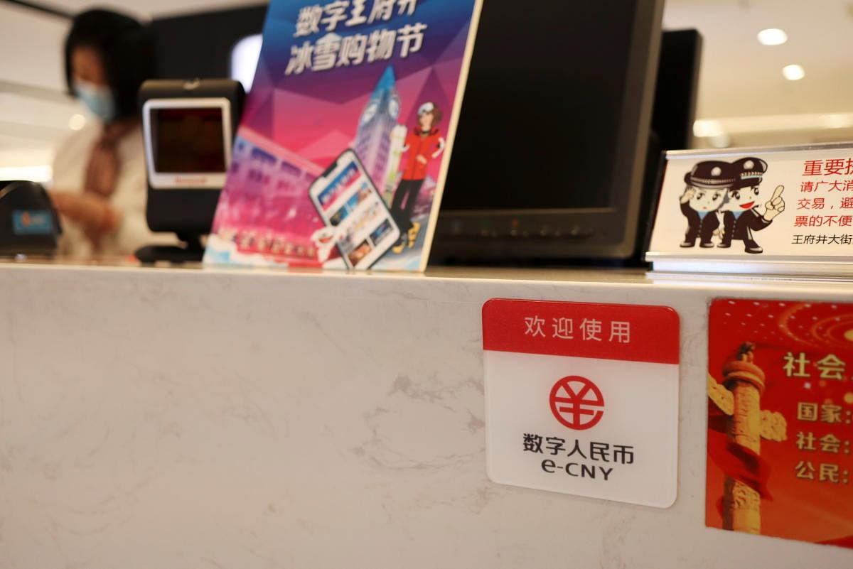 A sign of China's digital yuan, or e-CNY, is seen at a counter during a trial of the Digital Currency Electronic Payment (DCEP) at a shopping mall in Beijing, China February 10, 2021. Credit: REUTERS Photo