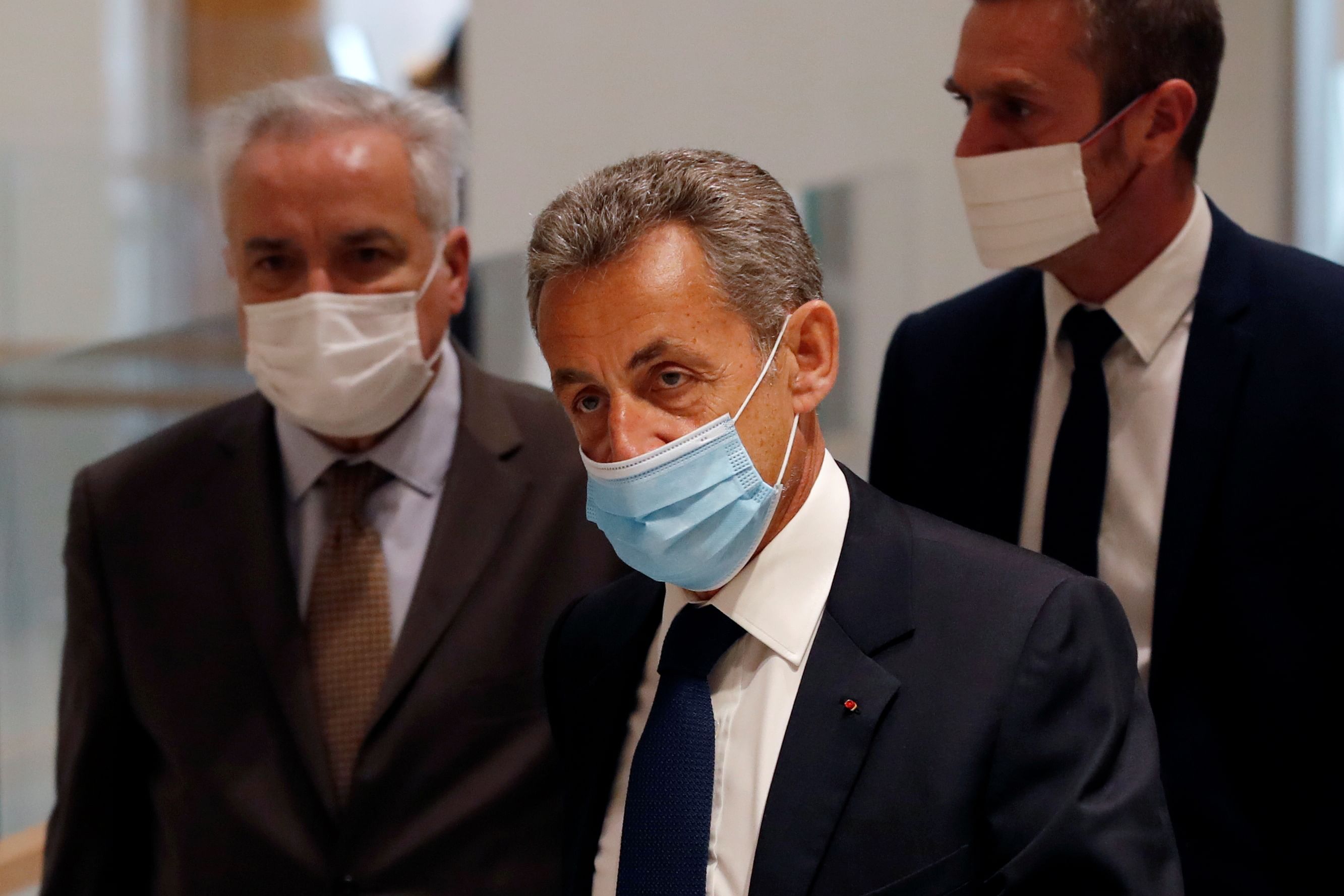 Former French President Nicolas Sarkozy, wearing a protective face mask, arrives for the verdict in his trial on charges of corruption and influence peddling, at Paris courthouse, France, March 1, 2021. Credit: REUTERS