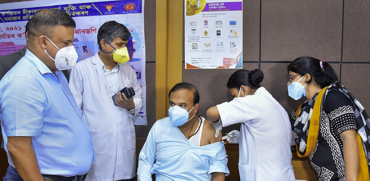 ssam State Health and Family Welfare Minister Himanta Biswa Sarma being administered the first dose of COVID-19 vaccine, at Gauhati Medical College Hospital (GMCH) in Guwahati. Credit: PTI Photo