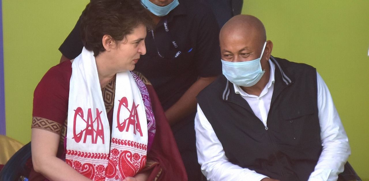 Priyanka Gandhi with Hagrama Mahilari, during a rally for the forthcoming state assembly elections. Credit: PTI Photo